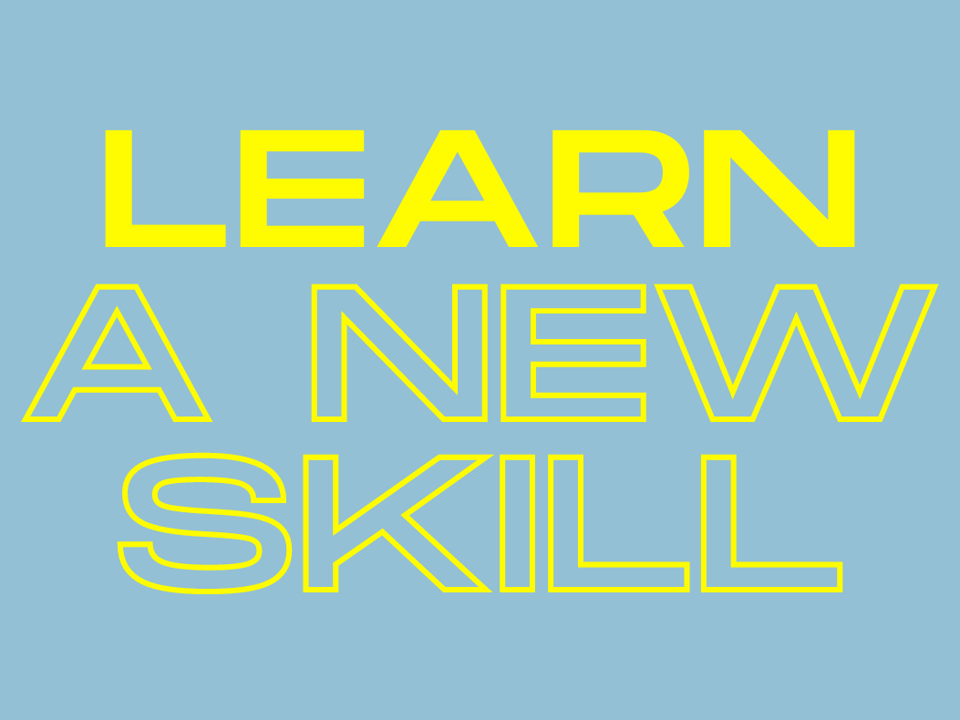 words learn a new skill in neon on blue background